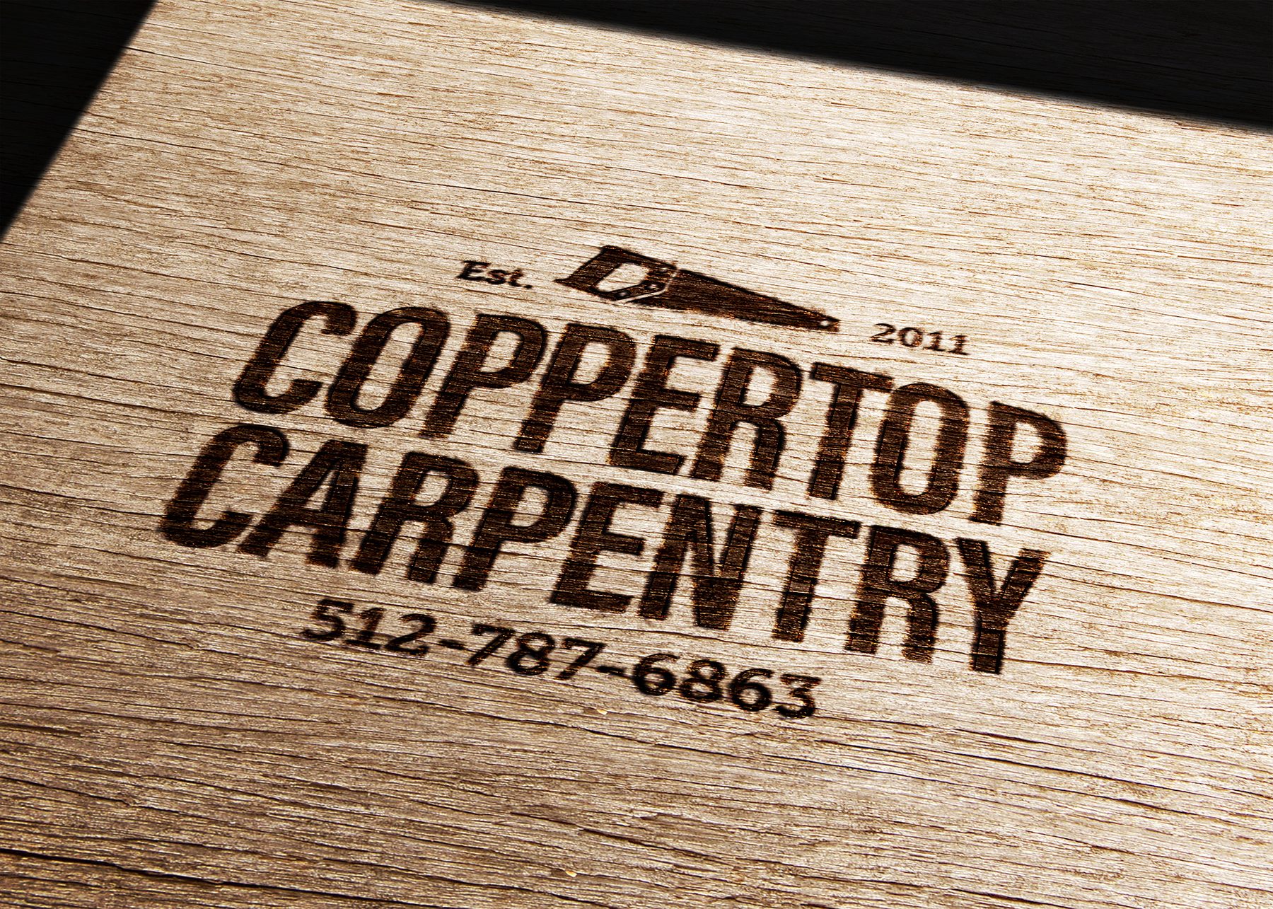 Coppertop Carpentry Company logo burned into wood