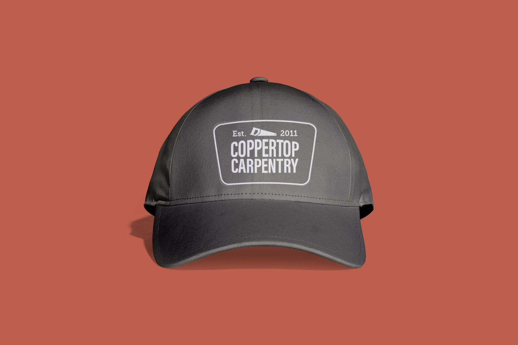 Coppertop Carpentry Company logo embroidered on a cap
