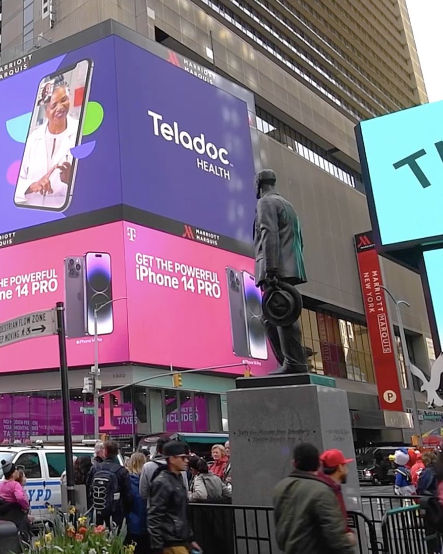 Teladoc Health ad on the Times Square digital billboard, NYC — street-level portrait view