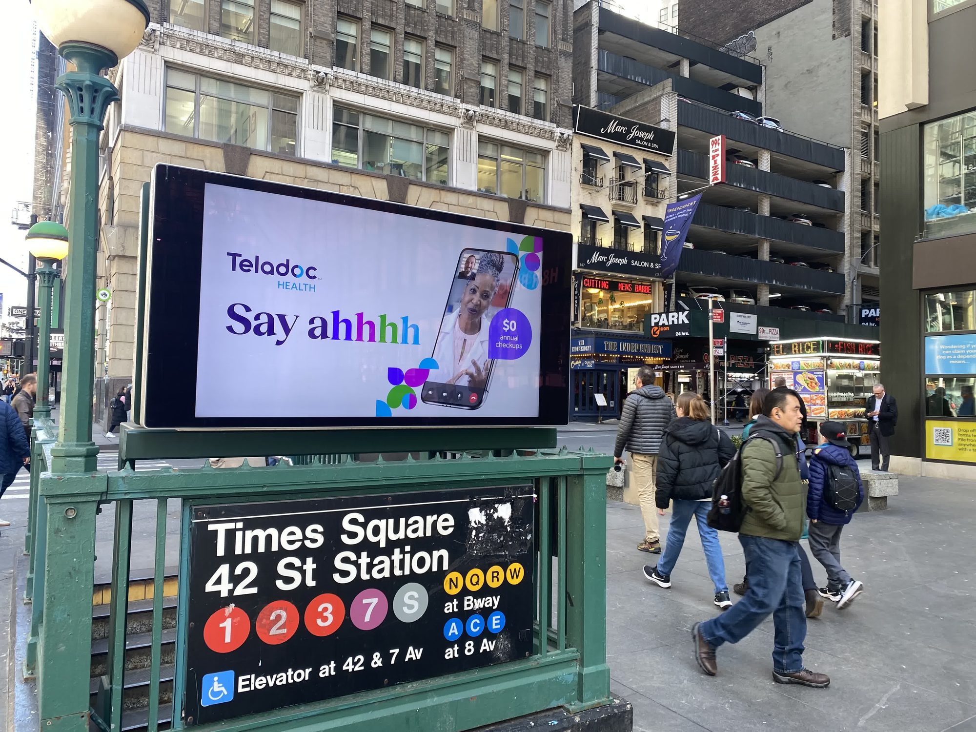 In-situ photo of the Times Square kiosk, showing the campaign at scale